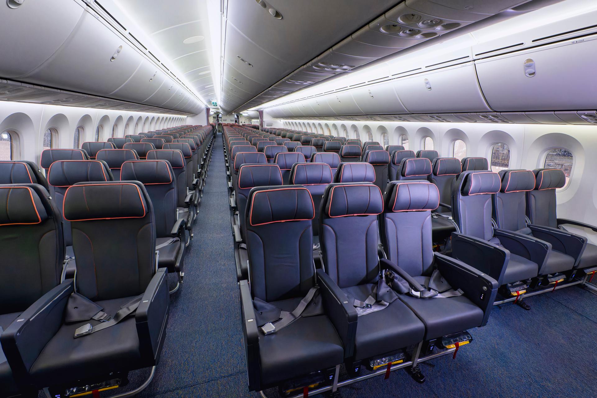 Photograph of passengers seated on the aircraft.