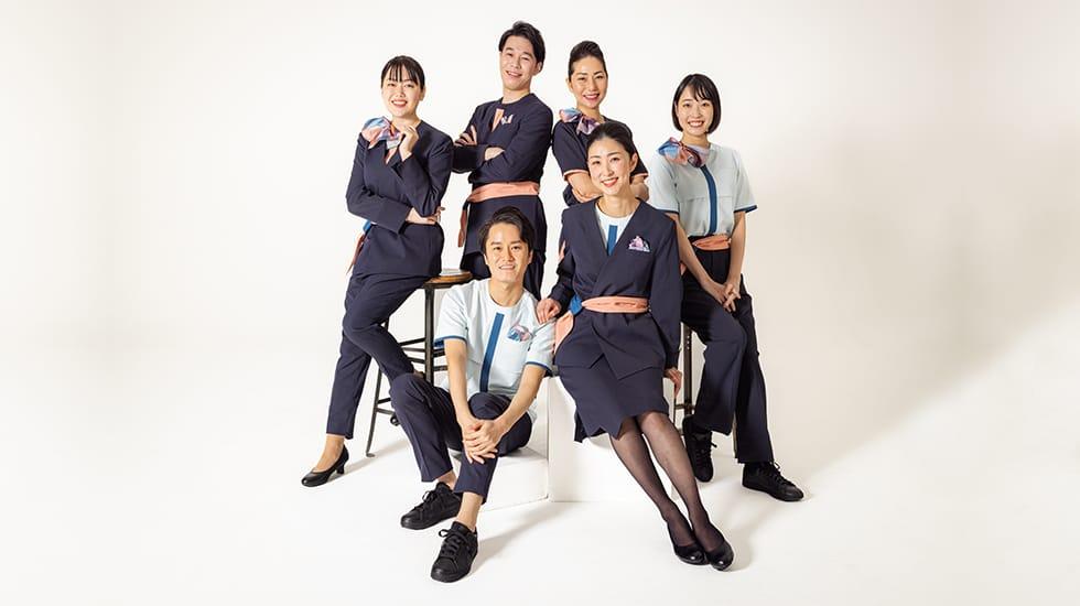 Group photograph of six cabin attendants wearing the new AirJapan uniform
